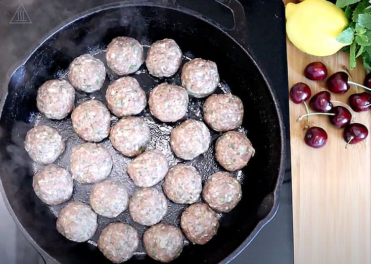 Cherry Meatballs Recipe - Start cooking meatballs in a cast iron pot